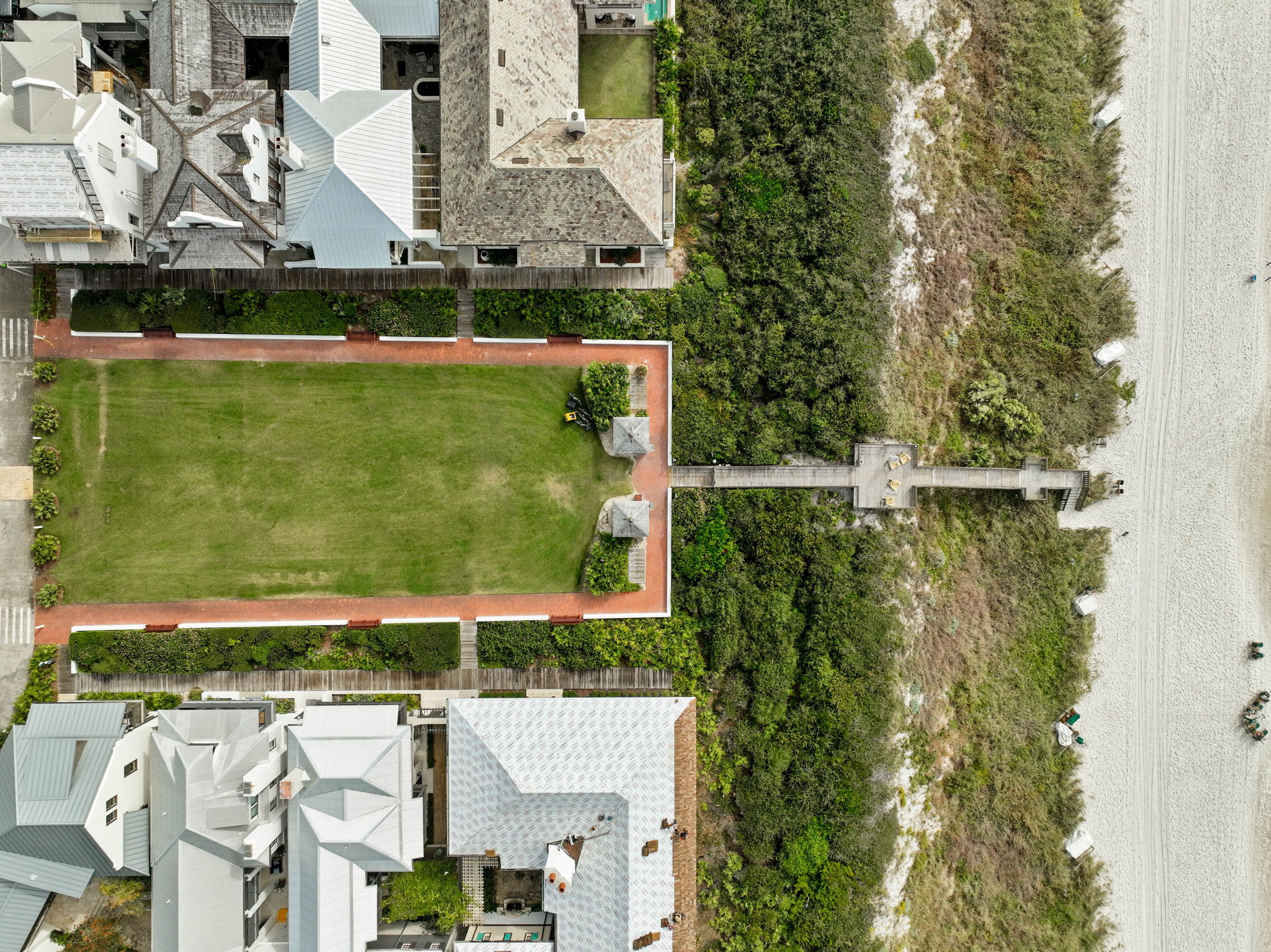 a scenic lawn located just steps from private beach access